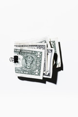 Clip holding folded one and five dollar bills