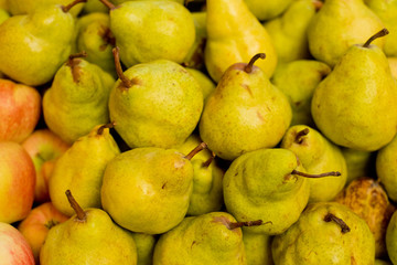 Pears in a box on the market.