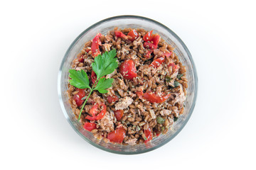 spelt with tuna and tomatoes, top view of summer fresh dish on white background
