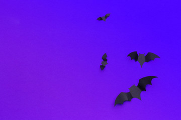 Obraz na płótnie Canvas halloween and decoration concept - paper bats flying