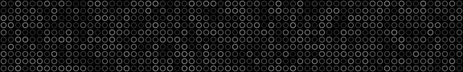 Abstract horizontal banner or background of small rings in black colors.