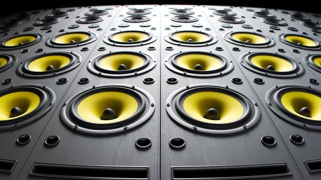 Yellow, modern speakers stacked in an endless wall loop. Membranes vibrate. 4KHD