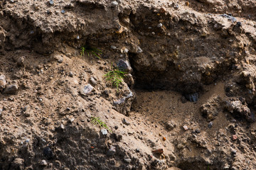 A pile of sand, stones and soil