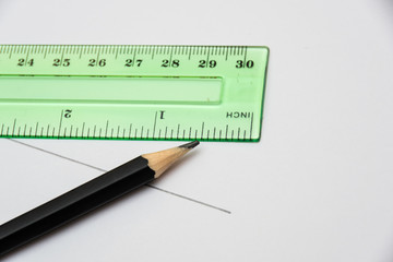 Ruler and pencil for study and measurement