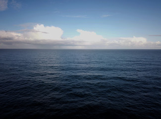 View over infinite blue ocean, space for text