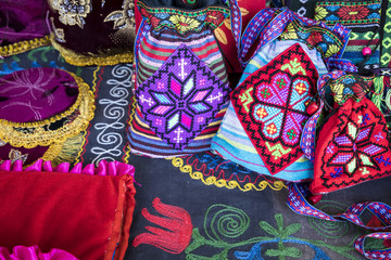 Market stalls with decorative tribal textile with colourful pattern made in Central Asia, Uzbekistan.