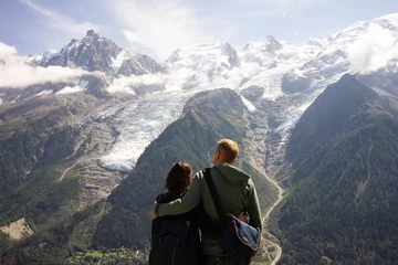 Washable wall murals Mont Blanc couples watching the stunning view of Mont Blanc