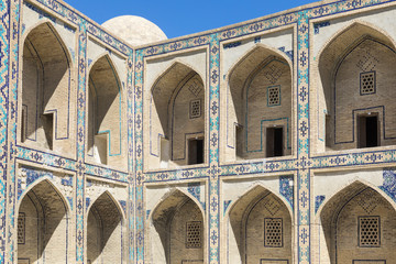 Madrasa facade in Bukhara, Uzbekistan.Traditional architecture.