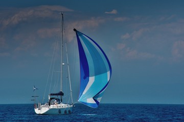 Summer on the sailboat, the ideal wind for a relaxing cruise on the blue sea.