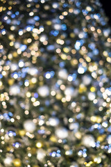 Obraz na płótnie Canvas Bokeh from a Christmas tree, glitter Christmas festive for background..