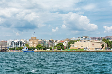 Thessaloniki, Greece - August 16, 2018: The National Theatre of Northern Greece & Aristotle's Theatre Building and White Tower in Thessaloniki.