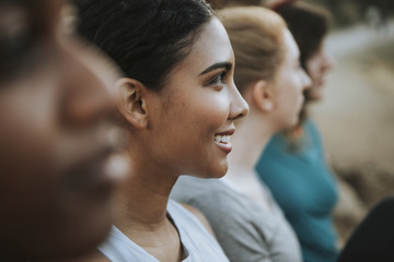 Friends relaxing on a park bench