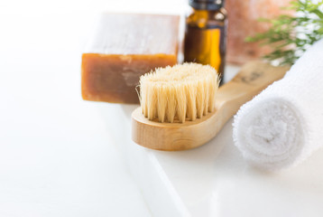 Handmade Coal Tar Soap Brush Pink Himalayan Salt Essential Oil Towel Juniper Twig on White Marble Background. Spa Wellness Relaxation Body Care Skincare Concept. Anti-Aging Therapy