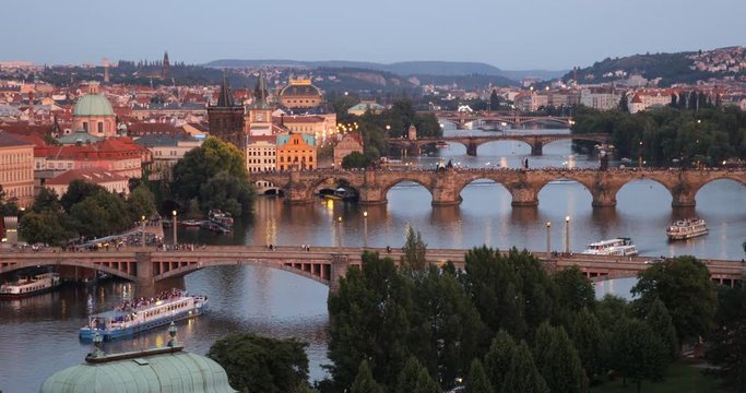 Scenic summer sunset aerial view of the Prague Old Town pier architecture and Charles Bridge over Vltava river in Prague, Czech Republic