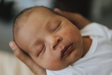 Closeup of a peaceful baby falling asleep