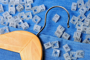 Wooden hanger and various plastic clothing size tags