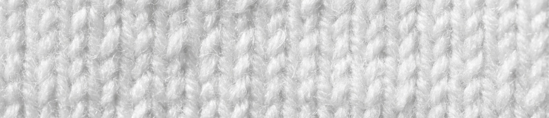 Knitting from woolen threads. Texture for the New Year's postcard. White background for various purposes.