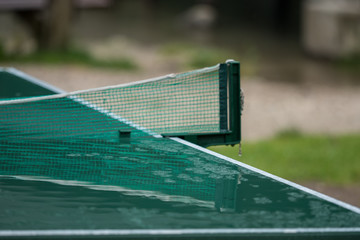A wet table tennis plate after the rain