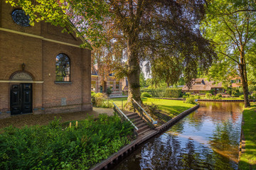 Church among high trees in Giethoorn, Netherlands