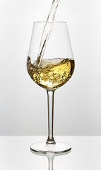 Beautiful splash of wine in a glass