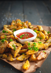 Close-up of roasted potatoes with rosemary, Parmesan cheese and fresh parsley on top