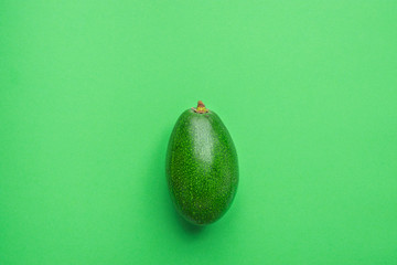 Ripe Beautiful Organic Avocado on Lettuce Green Solid Monochrome Background. Healthy Lifestyle...