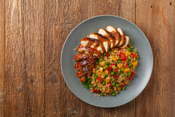 Grilled chicken breast in teriyaki sauce. Served with brown rice and vegetables.