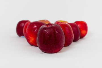 Red apples on the white background 