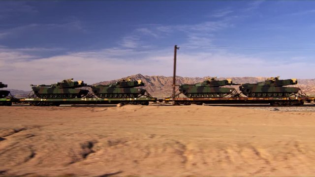 Military Tanks Being Transported via a Heavy Hauling Train.