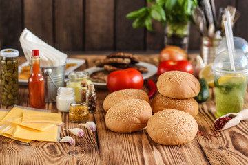 burger with meat, lettuce leaves and sauce (fast food). Sandwiches with meat. . food background. top view
