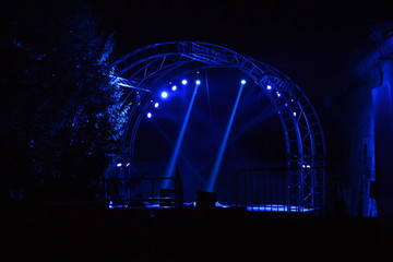 Stage lights on the empty stage at night outdoors