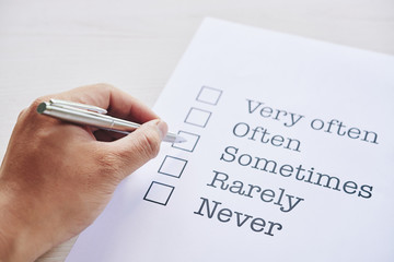 Hand of person choosing answer in frequency list