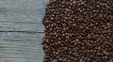Coffee beans on wood background