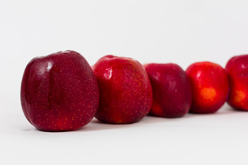 Red apples on the white background 