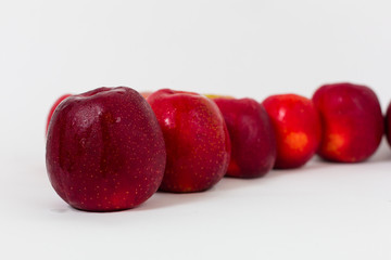 Red apples on the white background 