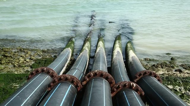 Pipes for intake of sea water and desalination in Doha, Qatar. Desalinization of sea water for city needs, water intake from Persian Gulf, Arabian Peninsula, Middle East