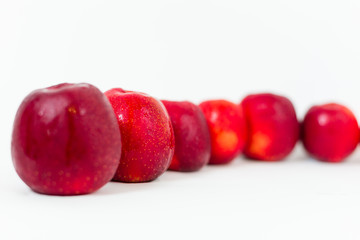 Red apples on the white background 
