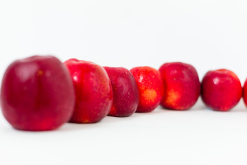 Red apples on the white background 