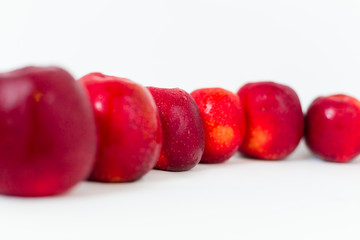 Red apples on the white background 