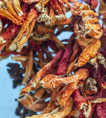 Close-up front shoot for dried colorful peppers with traditional hanging method in Turkey