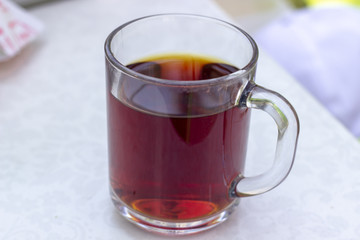 Obraz na płótnie Canvas Close-up shoot of Turkish tea in big transparent glass