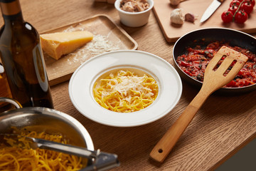 close-up shot of preparation of pasta composition on wooden table