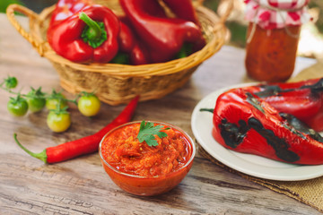 Served Ajvar on table with roasted peppers