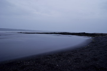 black sand on the beach