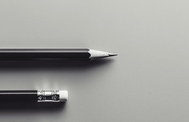 pencil and eraser. - monochrome background. - Business concept.