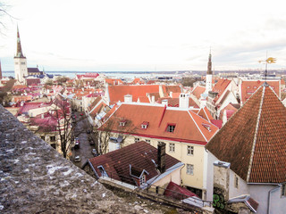 Cityscape aerial view on the old town with saint Nicholas church tower and Toompea hill in Tallinn, Estonia