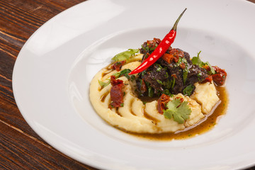 Beef with mashed potatoes and meat sauce