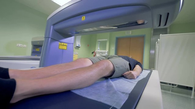 MRI scanning mechanism is inspecting a patient. X-ray procedure concept.