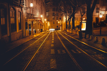 Fototapeta na wymiar Urban night scene. Old European city illuminated street at night, Lisbon, Portugal