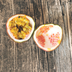 cut passion fruit on wooden background, from top,square format,